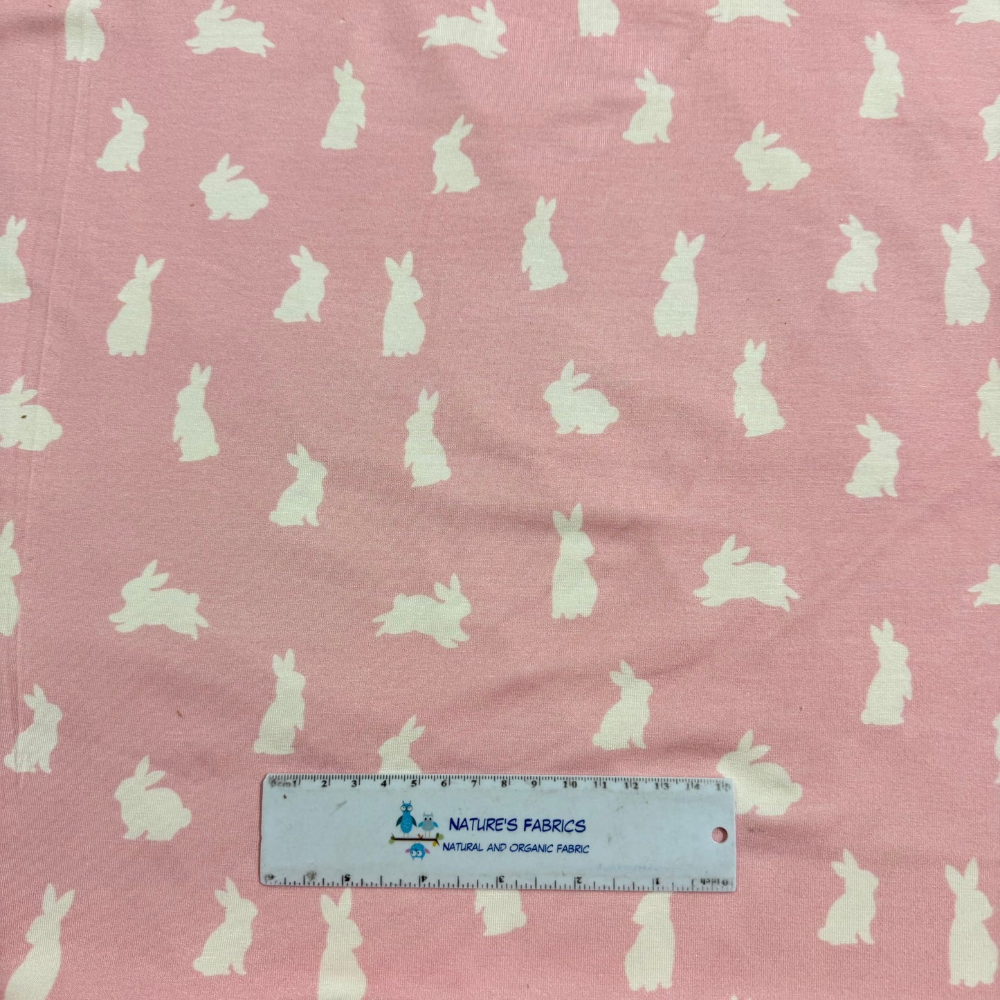 Off White Rabbits on Pink Bamboo/Spandex Jersey Fabric - Printed in the USA