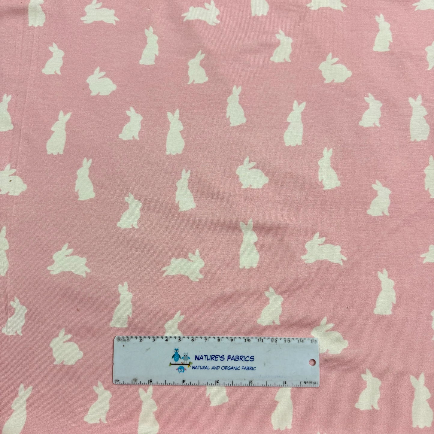 Off White Rabbits on Pink Bamboo/Spandex Jersey Fabric - Printed in the USA