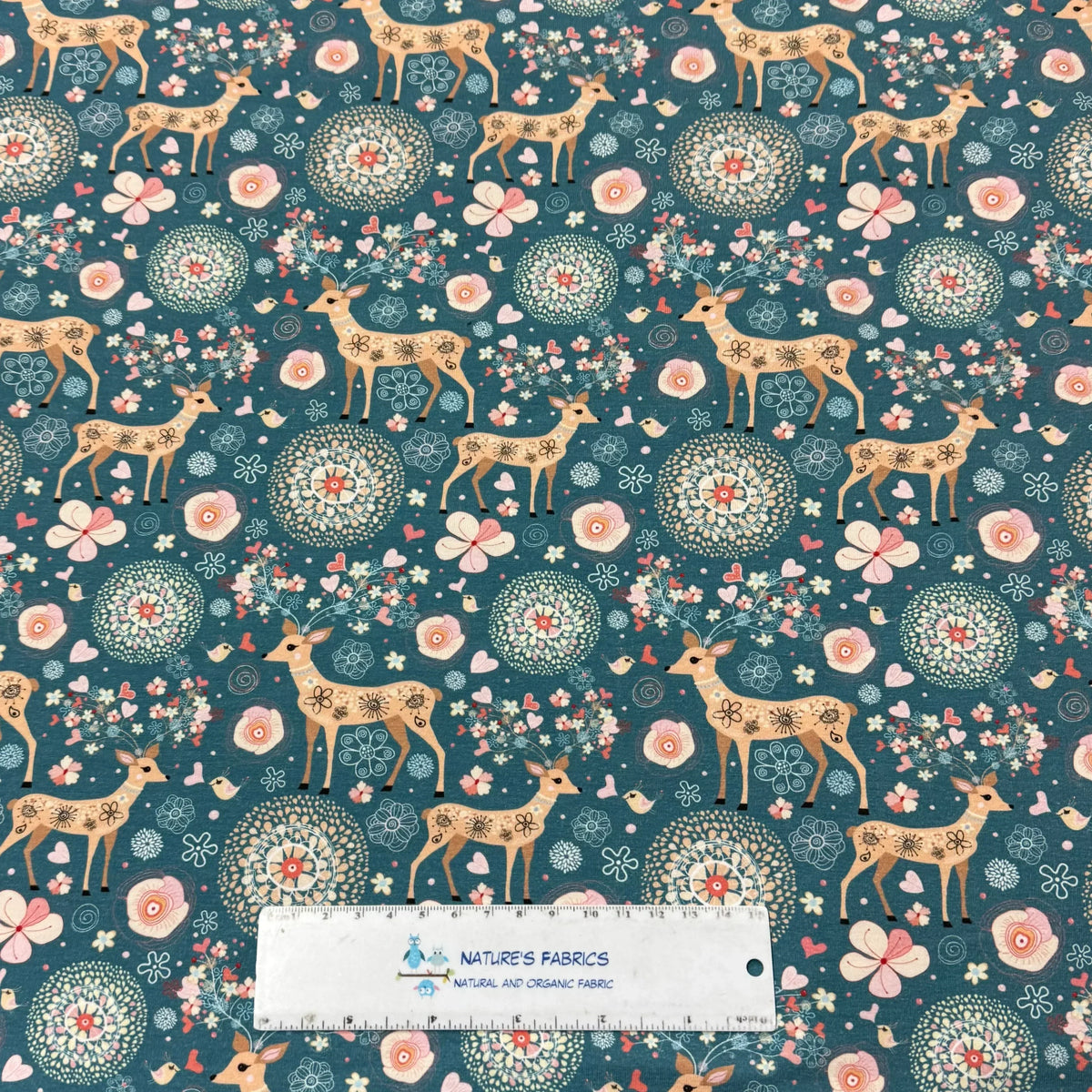 Nature's Fabrics organic cotton fabric with deer and floral pattern, eco-friendly textile design