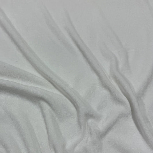 White organic bamboo fabric with soft, smooth texture and gentle folds