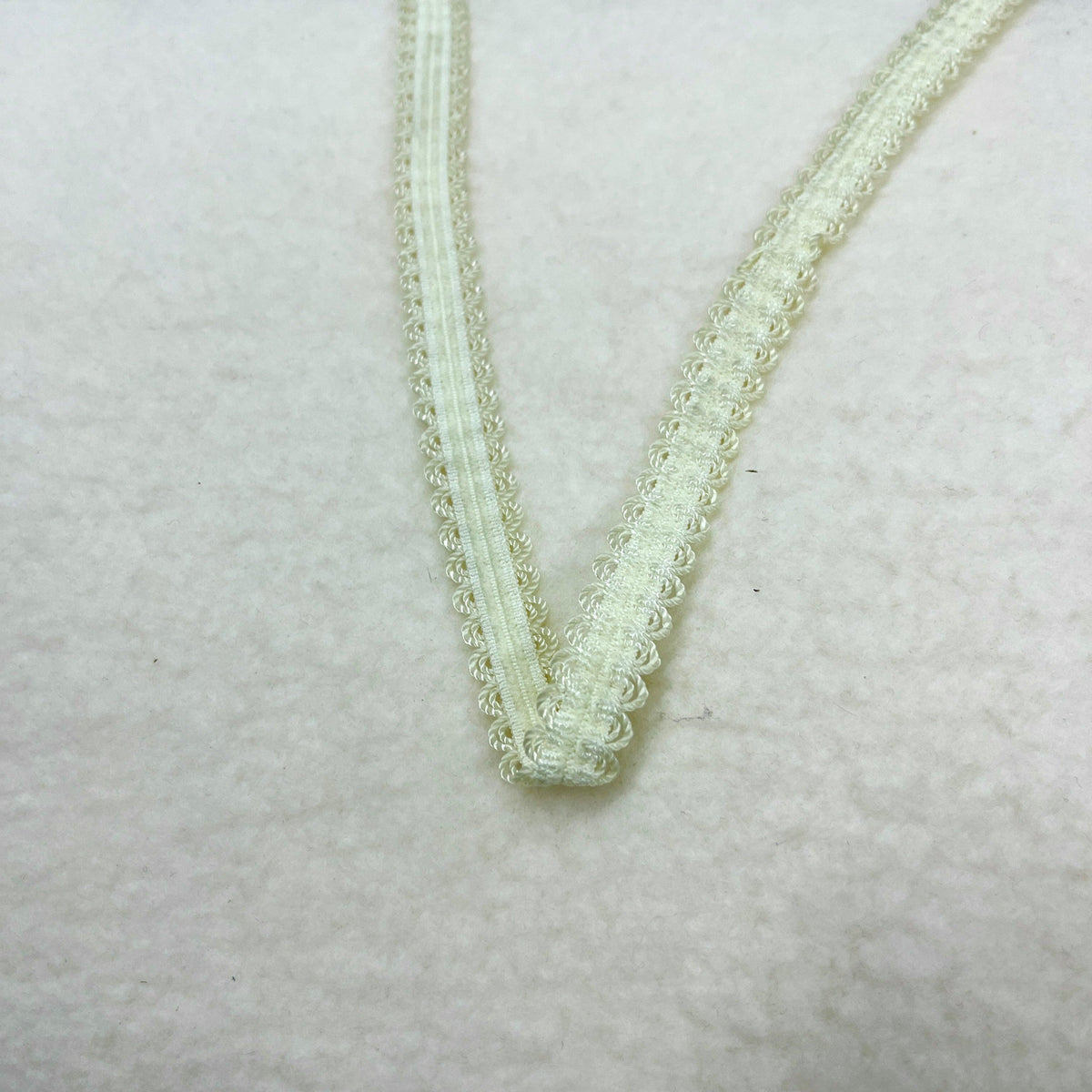 Pale yellow decorative lace trim from Nature's Fabrics
