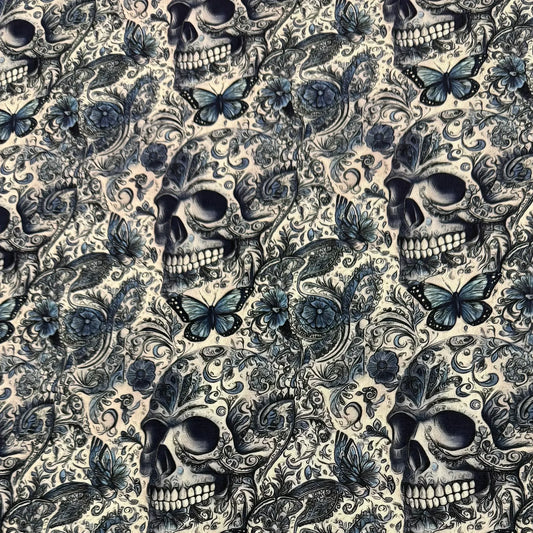 Nature's Fabrics skull and butterfly print fabric in blue and cream, featuring intricate floral patterns and gothic design.