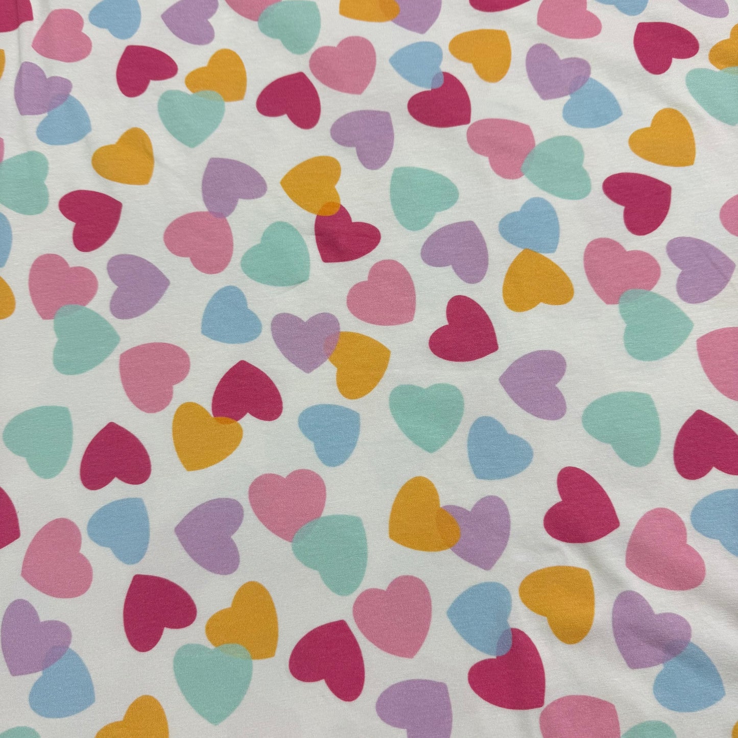 Pastel Heart Toss on Off White Bamboo/Spandex Jersey Fabric - Printed in the USA