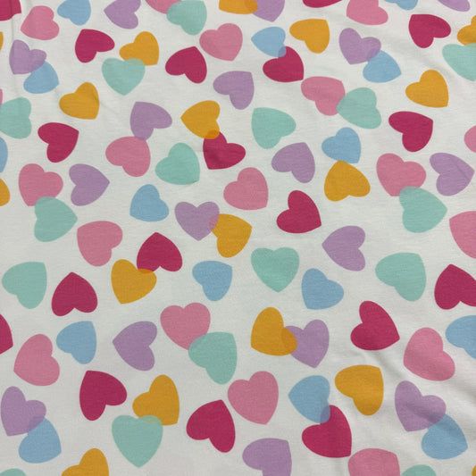 Nature's Fabrics white organic cotton fabric with colorful pastel heart print