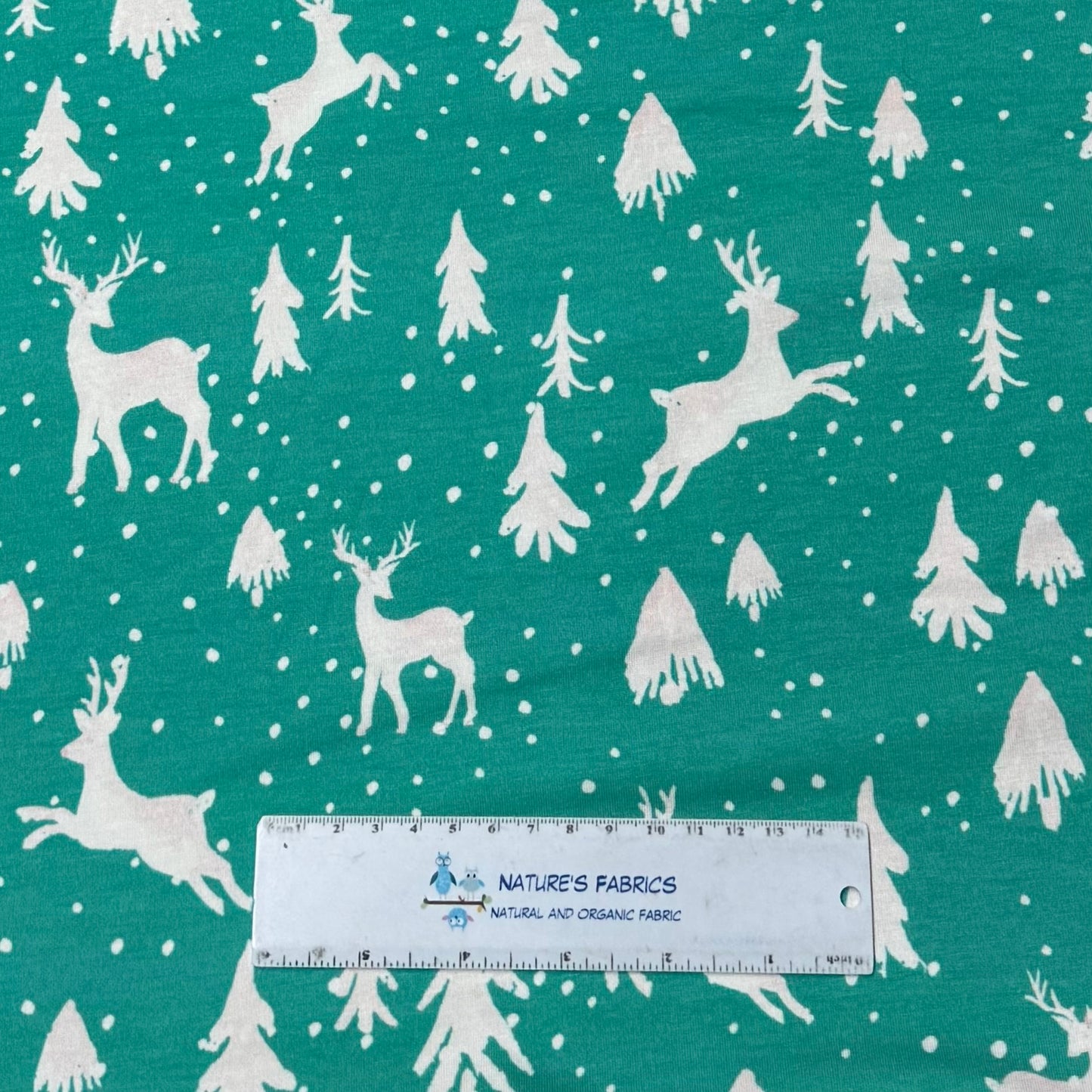 Off White Reindeer on Teal Bamboo/Spandex Jersey Fabric Pritned in the USA