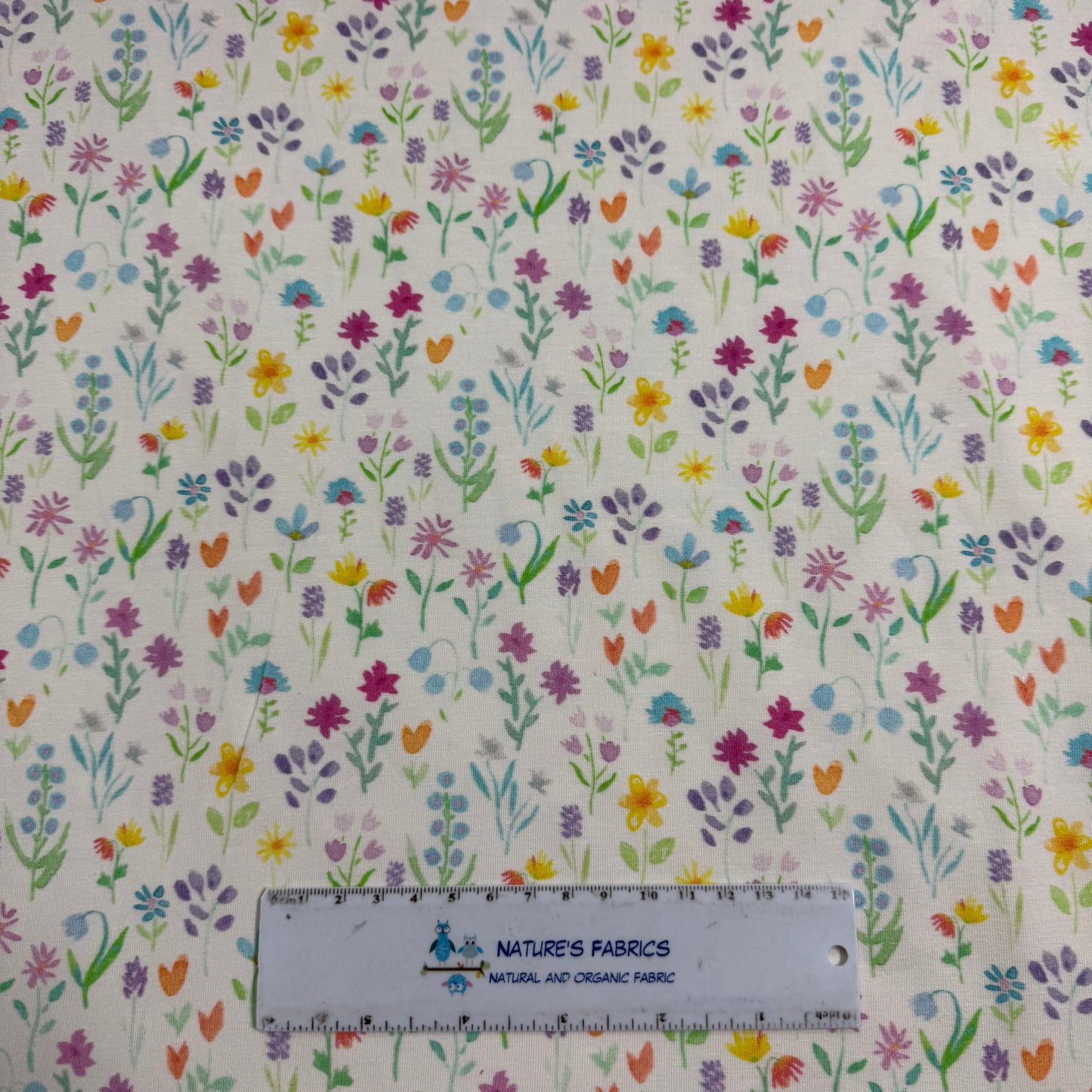Pastel Dainty Flowers on Off White Bamboo/Spandex Jersey Fabric - Printed in the USA