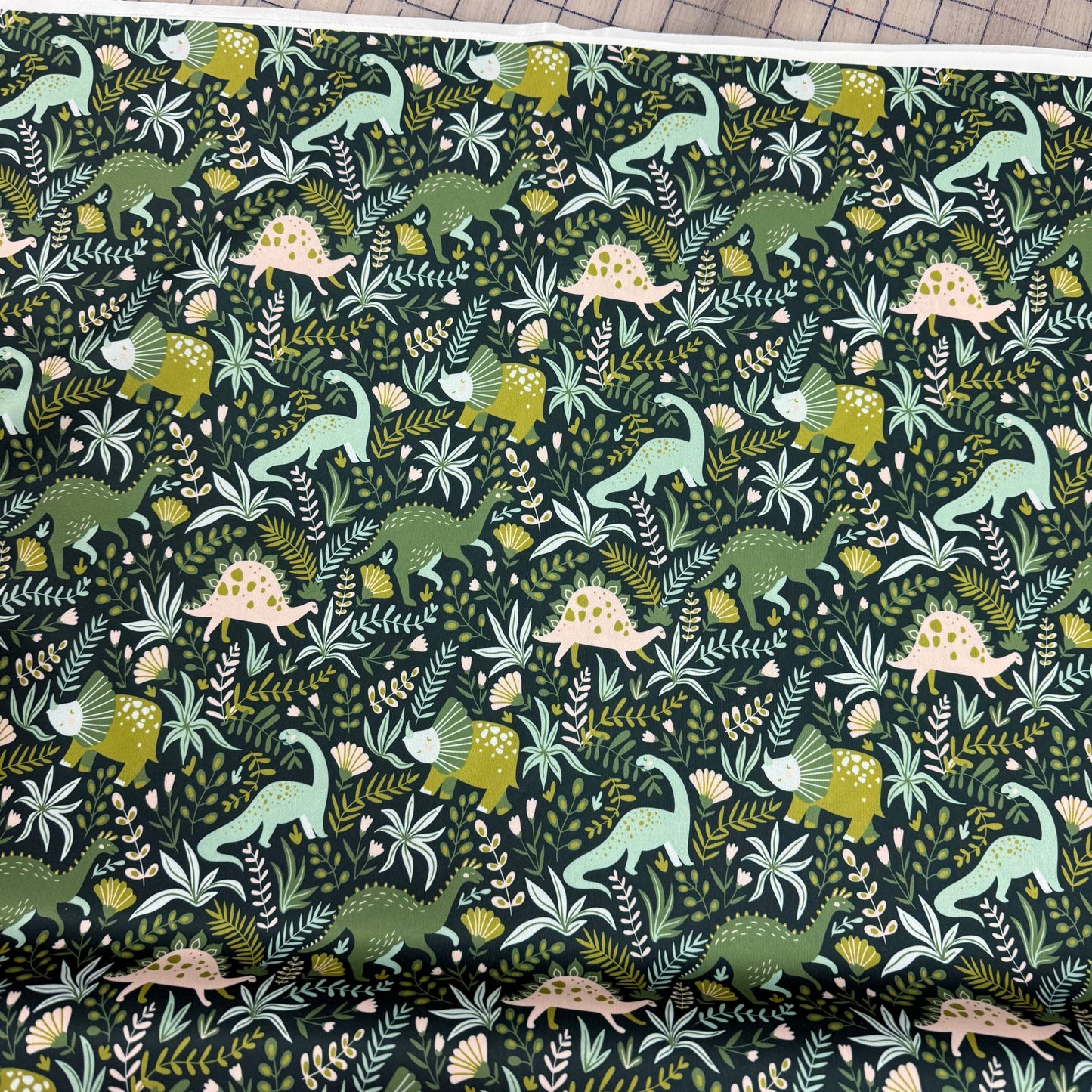 Green Dino on Green 1 mil PUL Fabric - Made in the USA
