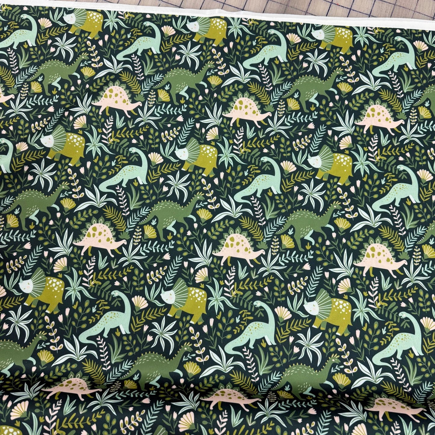 Green Dino on Green 1 mil PUL Fabric - Made in the USA
