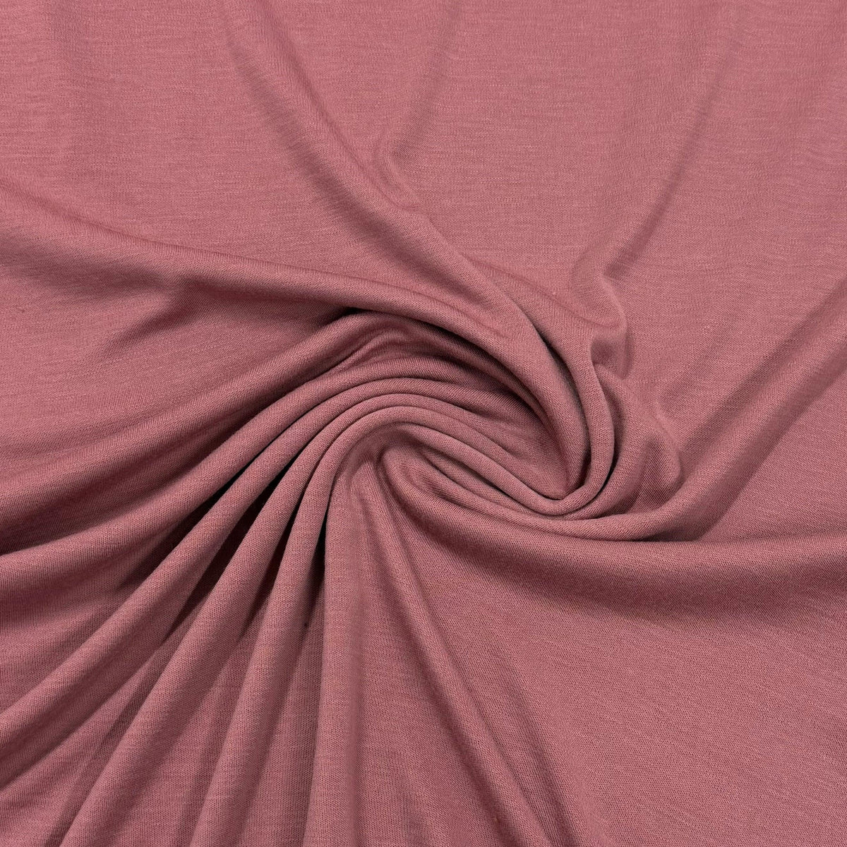 Dusty rose organic cotton fabric swirled texture by Nature's Fabrics