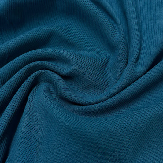Close-up of draped teal ribbed fabric from Nature's Fabrics.