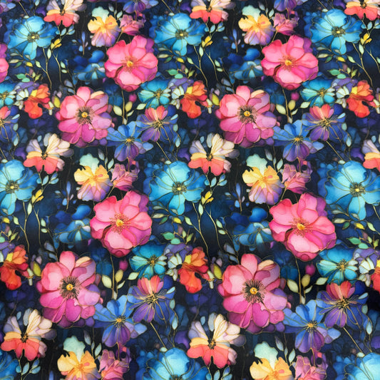 Nature's Fabrics floral print textile featuring vibrant pink, blue, and orange blossoms.