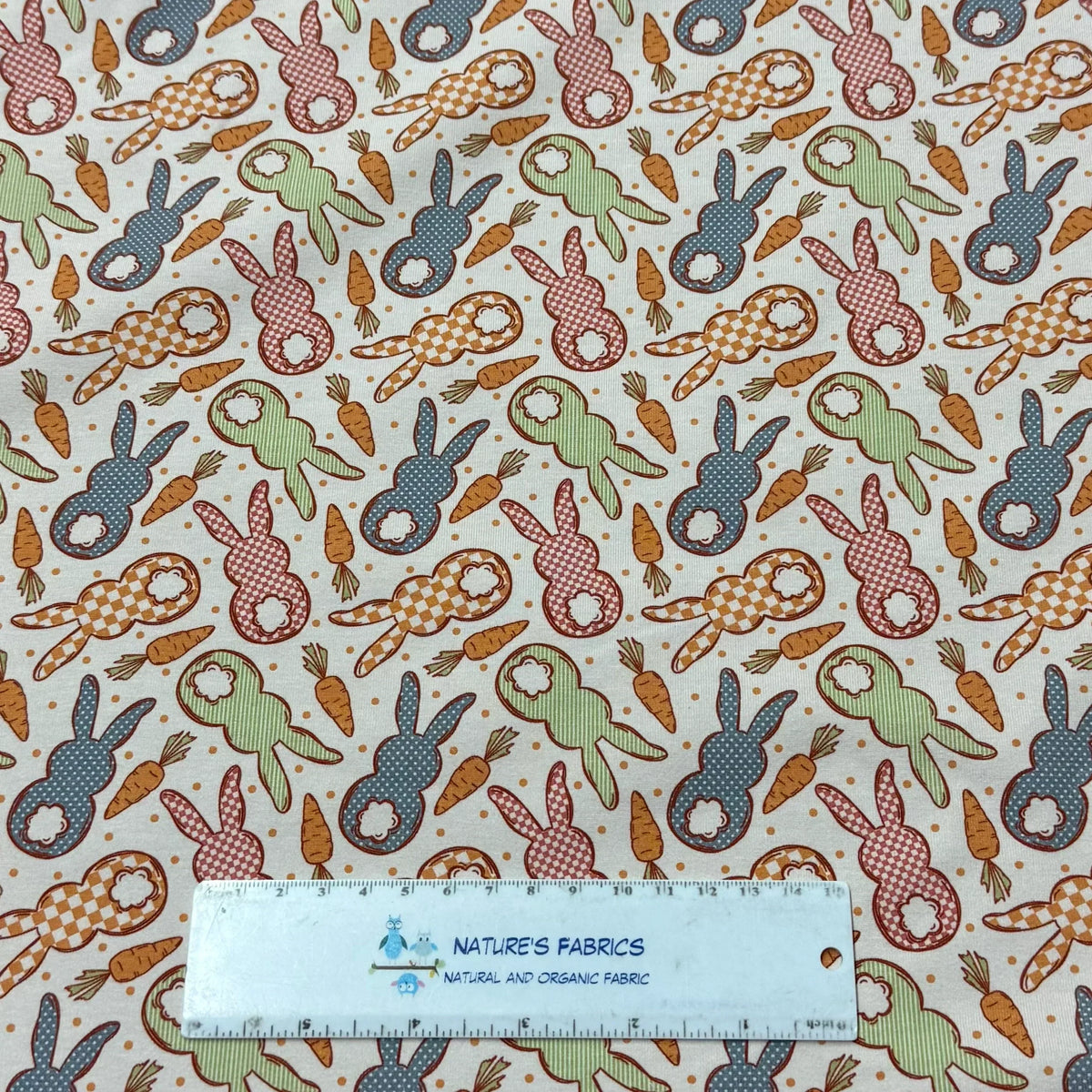 Nature's Fabrics organic cotton fabric with colorful bunny and carrot print, perfect for quilting and crafts