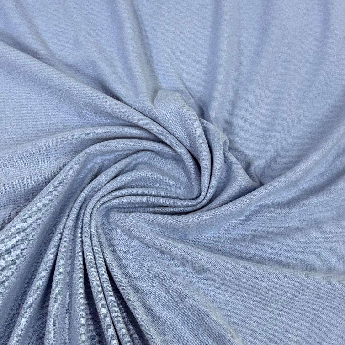 Soft light blue organic cotton fabric swirled for texture — Nature's Fabrics