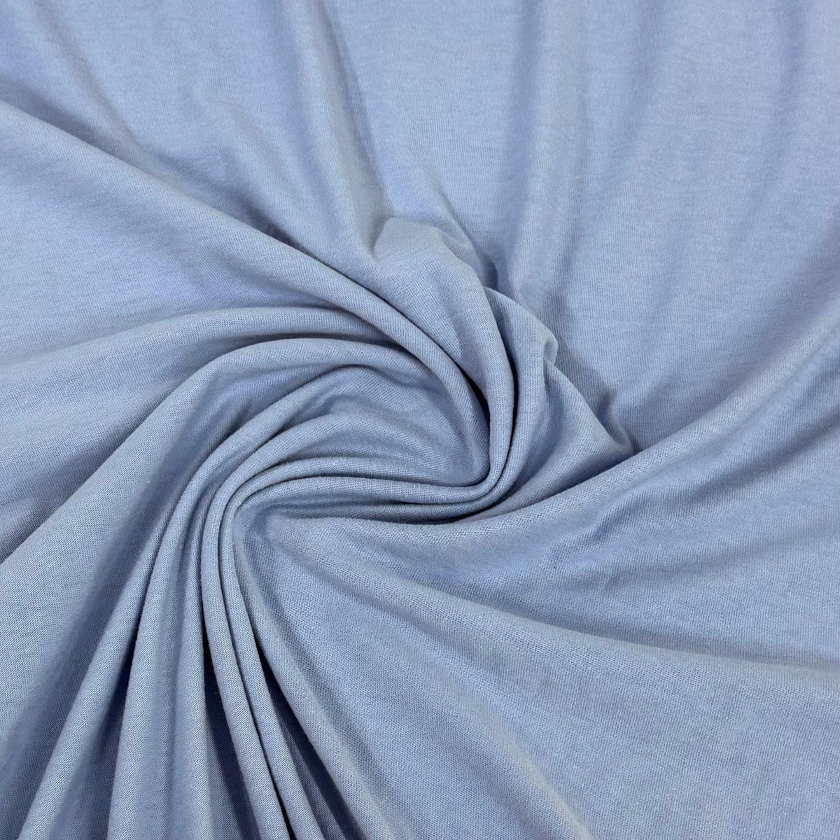 Soft light blue organic cotton fabric swirled for texture — Nature's Fabrics
