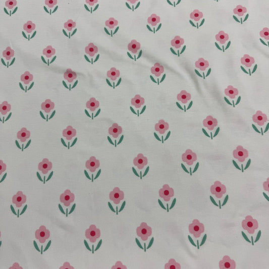 Nature's Fabrics white organic cotton fabric with a small pink floral print