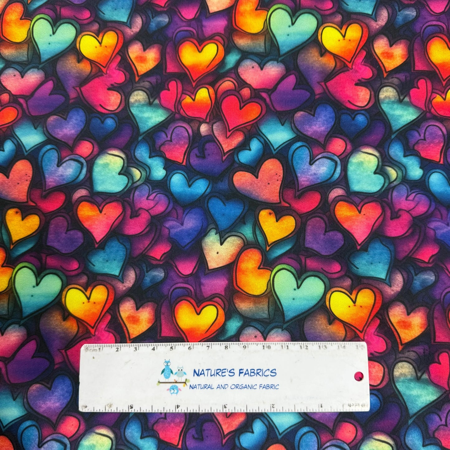 Vibrant rainbow heart pattern fabric by Nature's Fabrics, natural and organic cotton