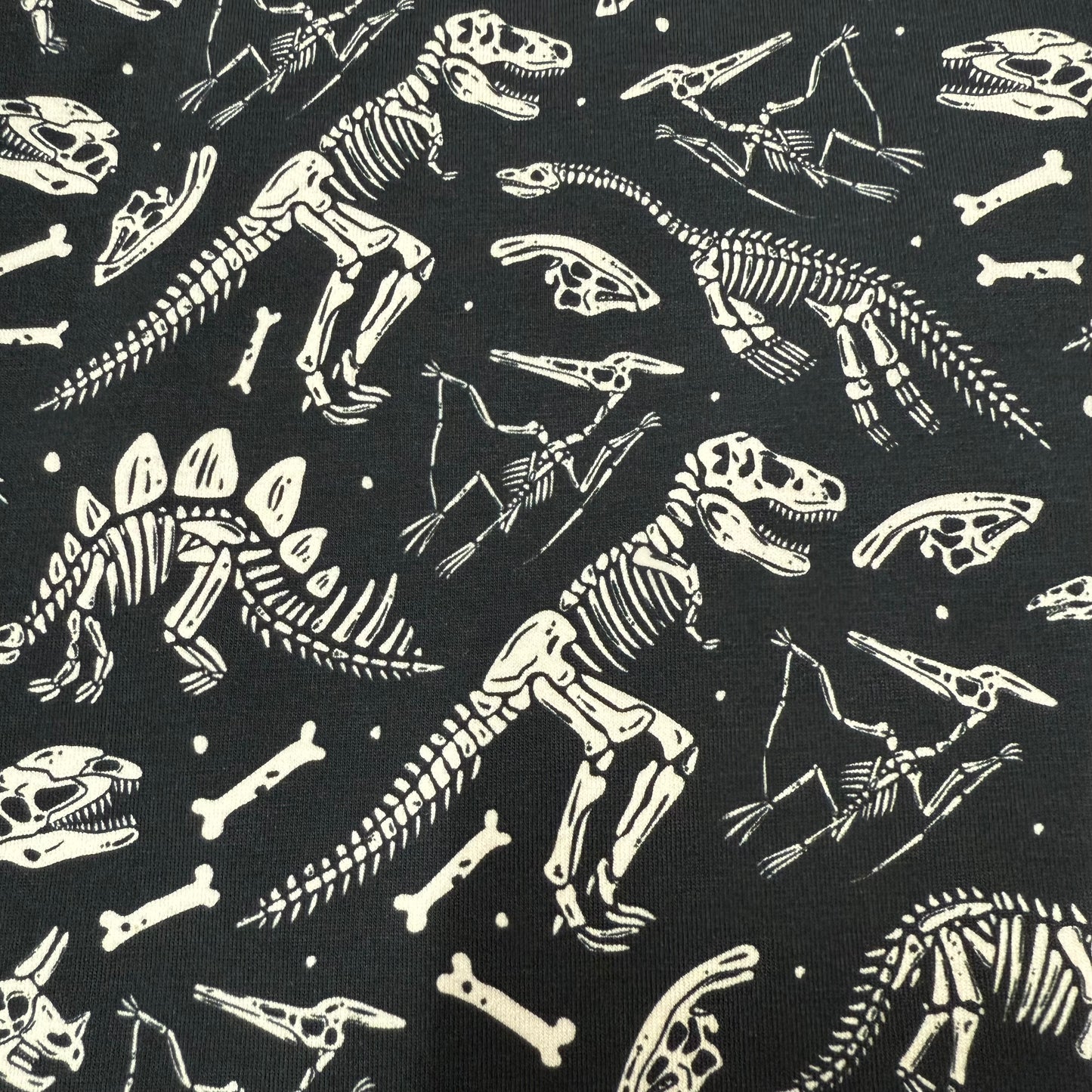 Dino Skeletons on Organic Cotton/Spandex Jersey Fabric