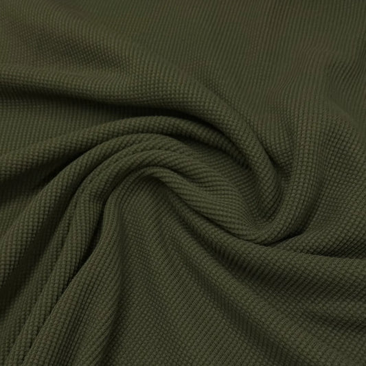 Close-up of olive green ribbed natural fabric from Nature's Fabrics