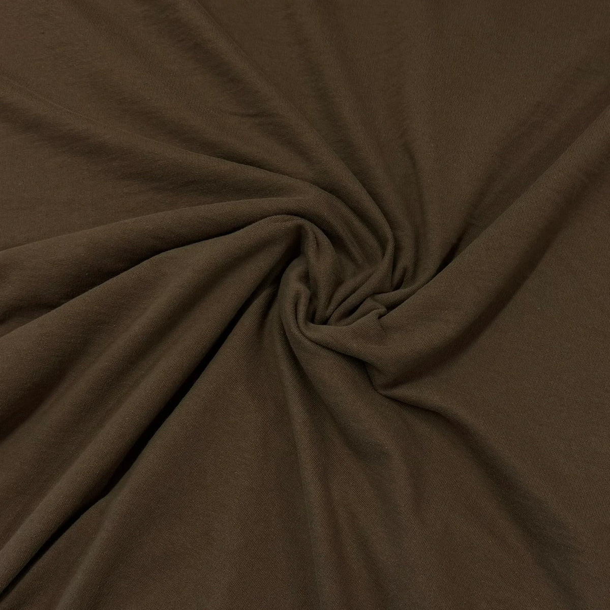 Rich brown organic cotton fabric by Nature's Fabrics, soft texture and natural drape for eco-friendly sewing projects