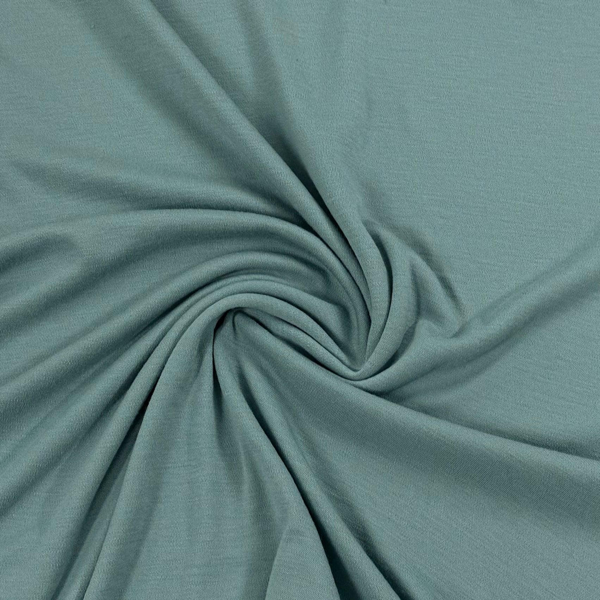 Soft sage green organic cotton fabric swirled for texture — Nature's Fabrics