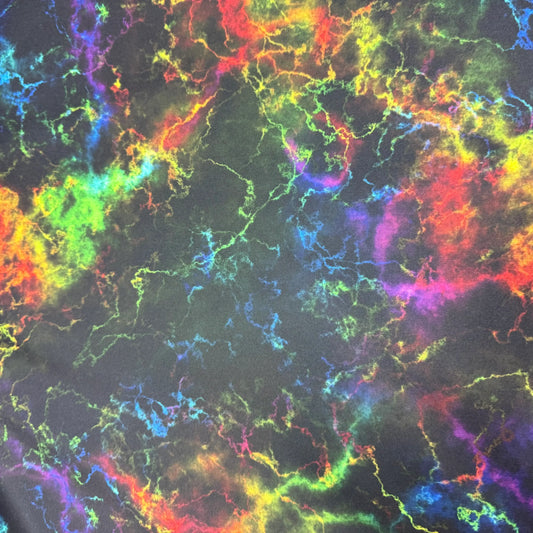 Nature's Fabrics rainbow lightning bolt pattern on black fabric