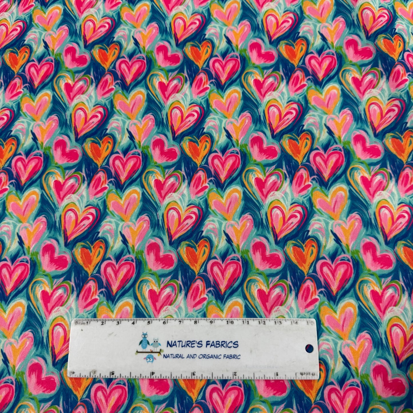 Nature's Fabrics vibrant heart pattern organic cotton fabric with colorful designs
