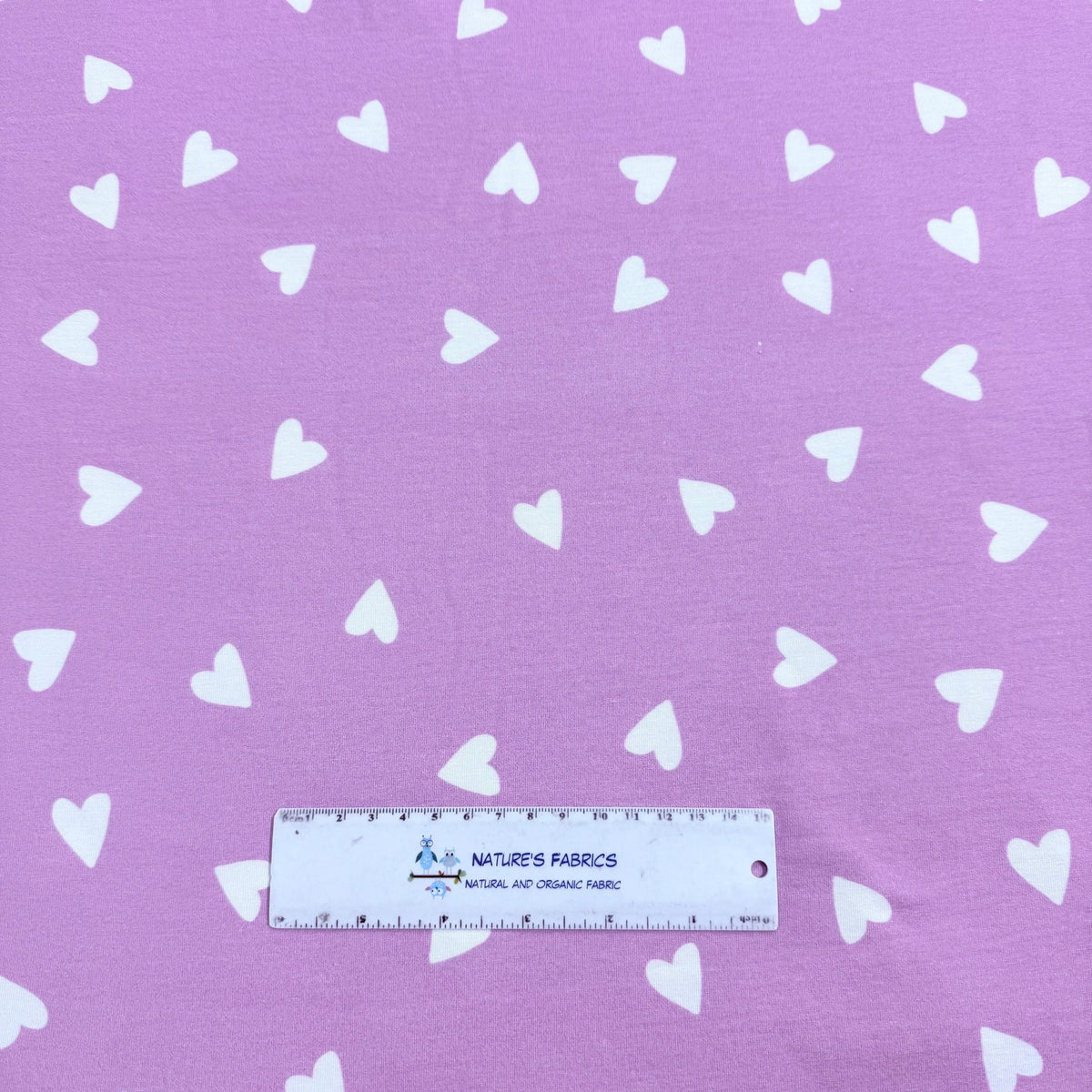 Purple fabric with white hearts by Nature's Fabrics, natural and organic textile