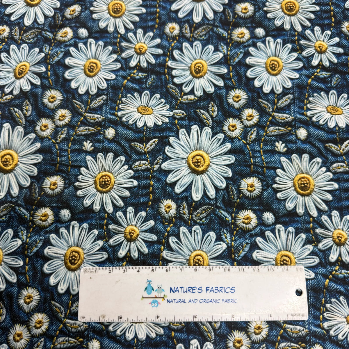 Nature's Fabrics blue daisy floral pattern organic cotton fabric with ruler for scale