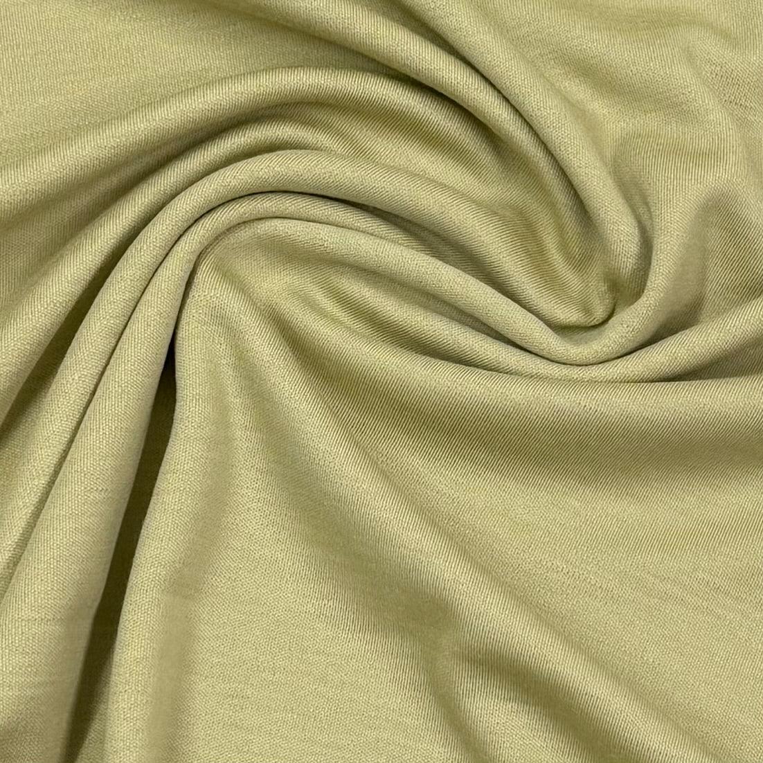 Soft olive green organic cotton fabric by Nature's Fabrics, ideal for eco-friendly sewing projects