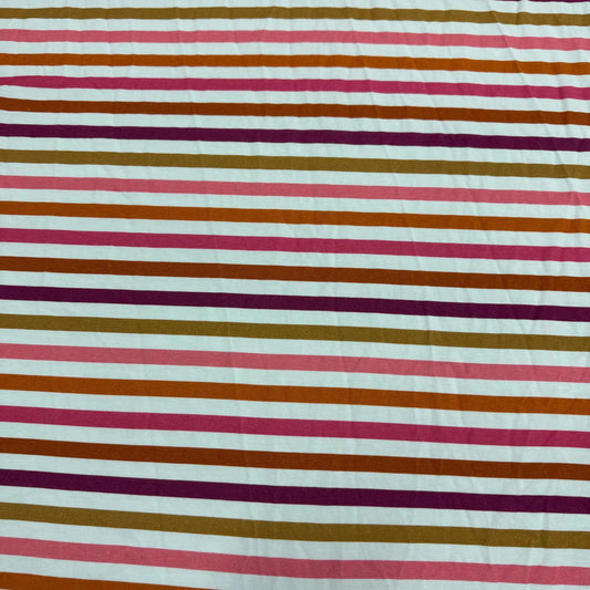 Nature's Fabrics multi-colored horizontal striped fabric in pink, brown, and purple