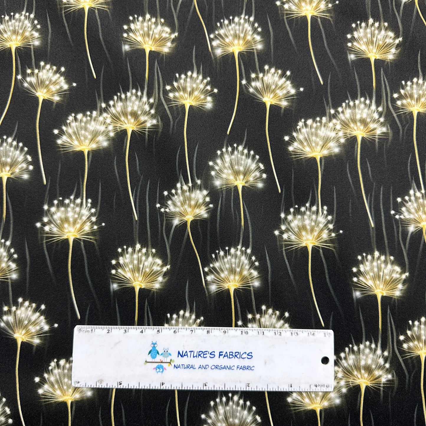 Dandelions on Black 1 mil PUL Fabric - Made in the USA