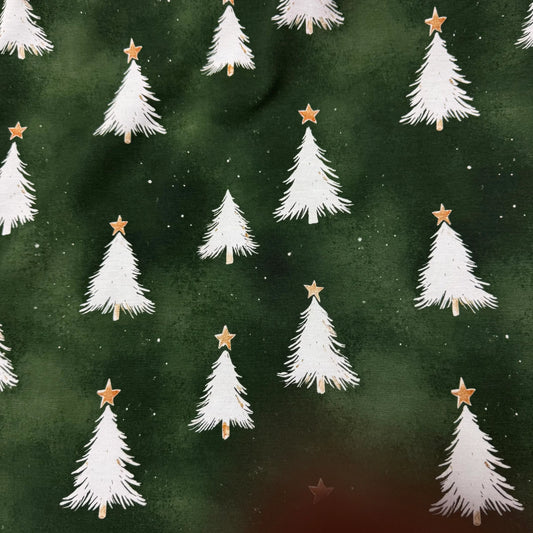Nature's Fabrics Christmas tree print fabric with white trees, gold stars on dark green background