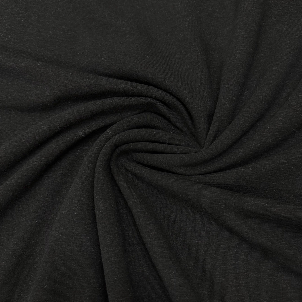 Black organic cotton fabric swirled for texture, Nature's Fabrics