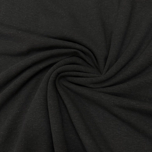 Black premium natural fabric from Nature's Fabrics swirled into a spiral.