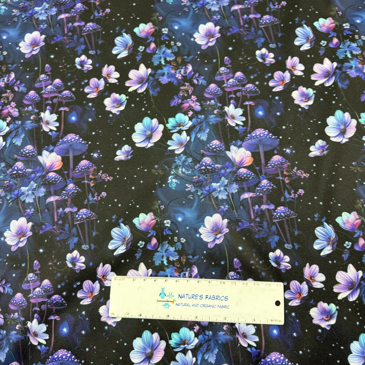 Nature's Fabrics purple floral and mushroom print fabric with starry night design