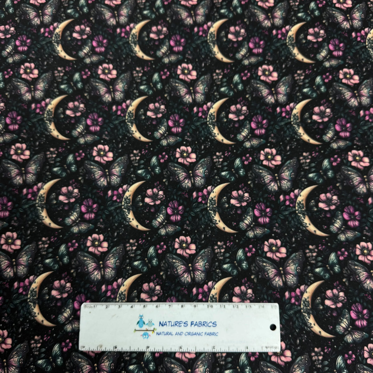 Nature's Fabrics butterfly and moon floral print fabric with pink flowers and crescent moons