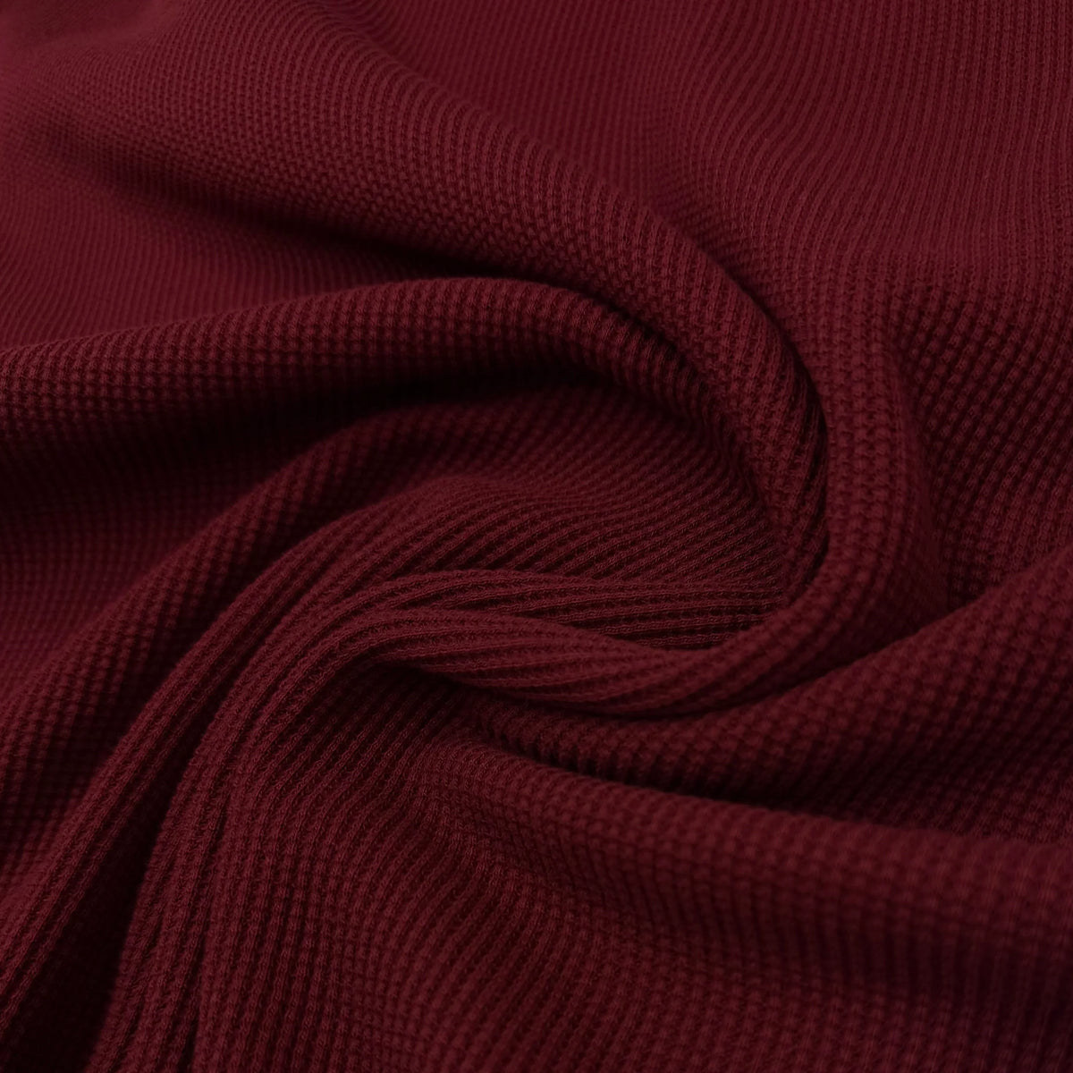 Deep red ribbed knit fabric swirled for texture, Nature's Fabrics
