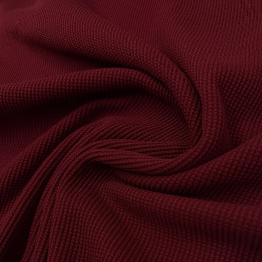 Close-up of burgundy ribbed knit fabric from Nature's Fabrics