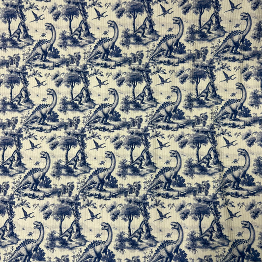 Nature's Fabrics blue and white toile fabric with dinosaur and prehistoric scenery pattern