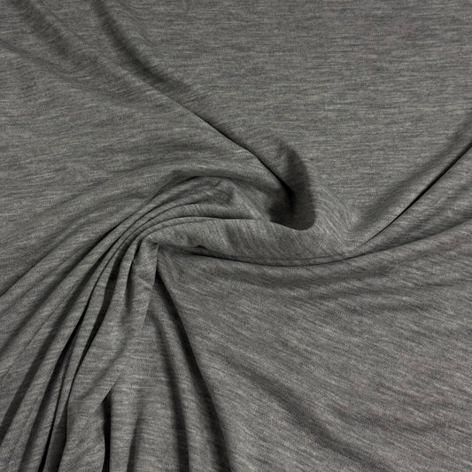 Close-up of draped grey heathered natural fabric from Nature's Fabrics