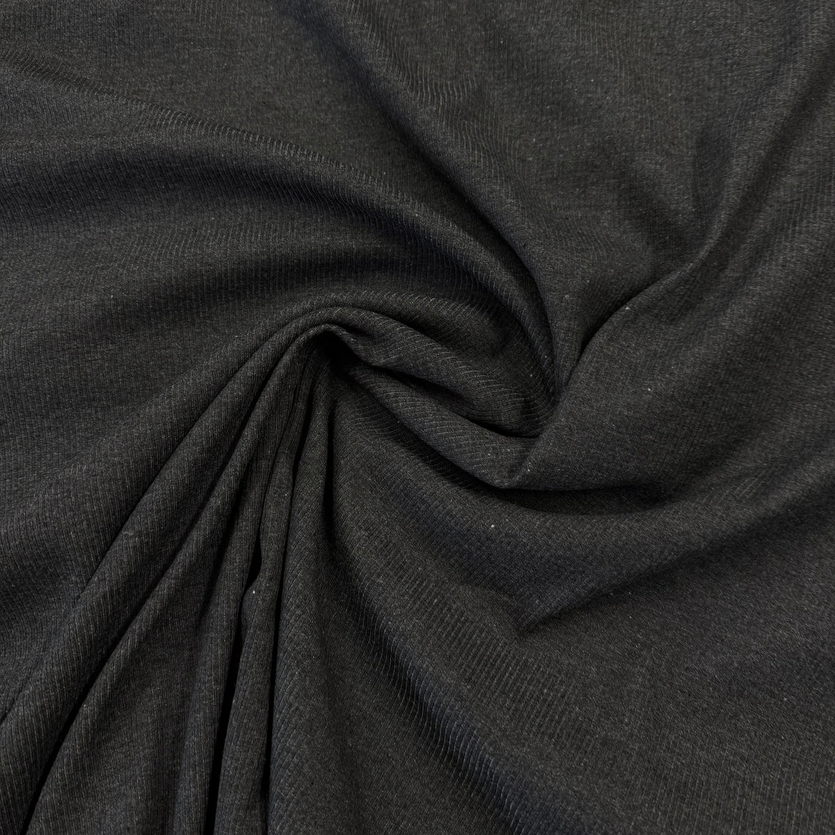 Dark gray ribbed organic cotton fabric by Nature's Fabrics, eco-friendly and soft texture