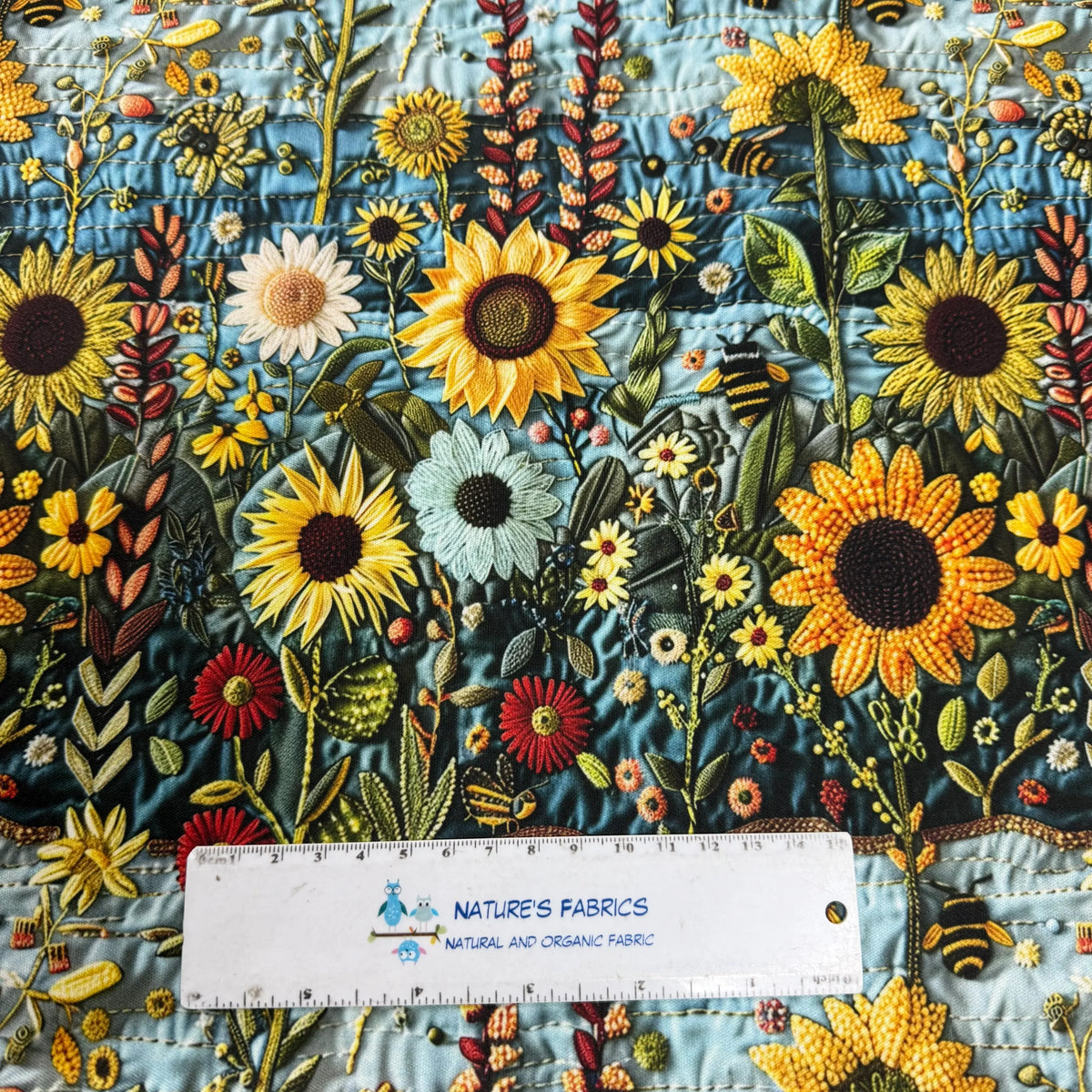 Nature's Fabrics sunflower floral print fabric with bees, vibrant blooms, and organic texture