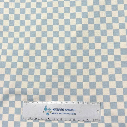 Nature's Fabrics light blue and white gingham checkered organic fabric with a ruler for scale.