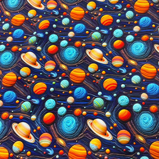 Nature's Fabrics textile featuring a colorful, textured outer space pattern with planets.
