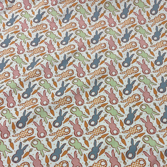 Nature's Fabrics Easter bunny and carrot print fabric in gingham, polka dot, and striped patterns