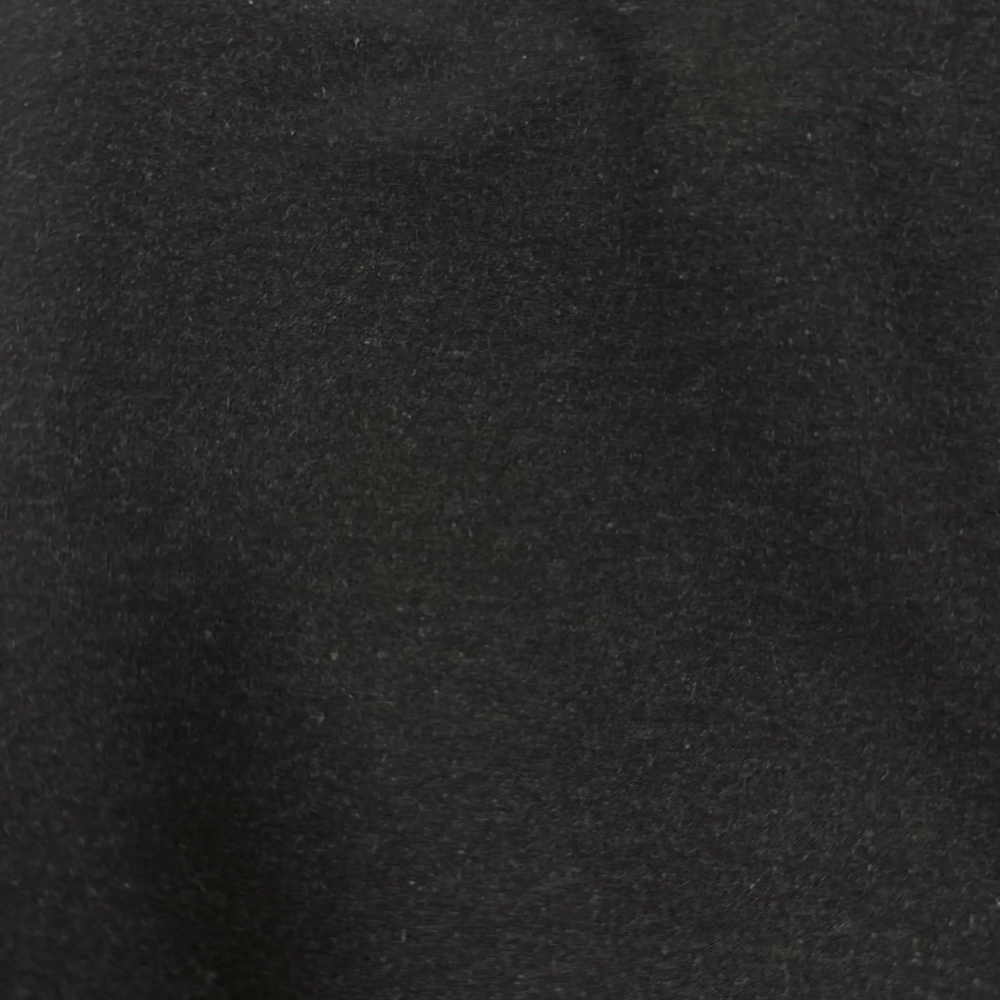 Close-up of black organic cotton fabric texture, soft and eco-friendly textile