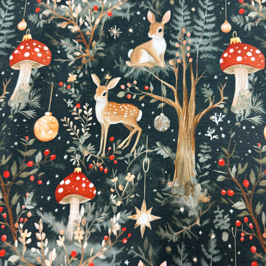 Nature's Fabrics festive forest fabric with deer, mushrooms, and holiday ornaments