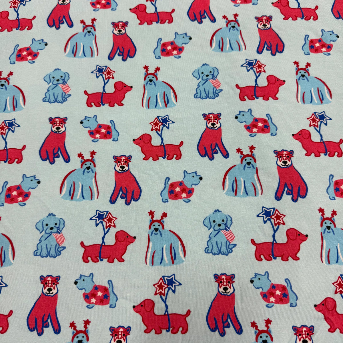 Nature's Fabrics patriotic red, white, and blue dog print organic cotton fabric.