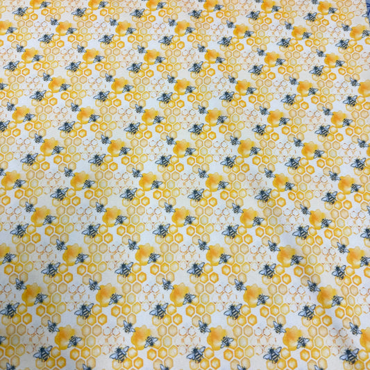 Bee and honeycomb pattern fabric by Nature's Fabrics, organic cotton design for eco-friendly sewing projects