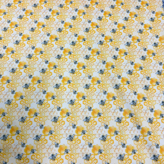 Bee and honeycomb pattern fabric by Nature's Fabrics, organic cotton design for eco-friendly sewing projects